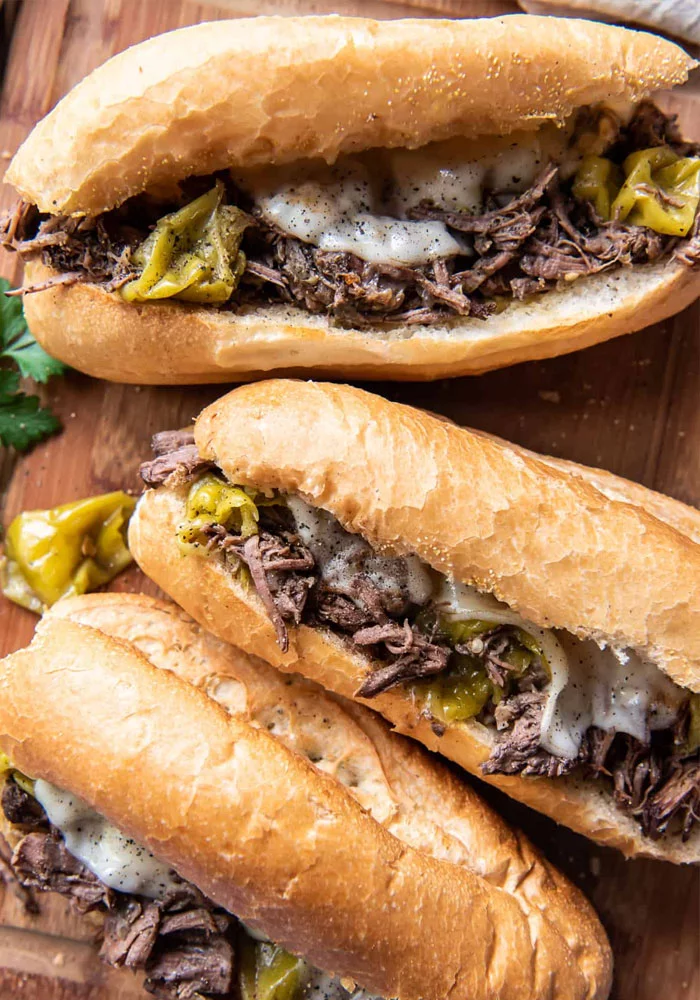 Italian beef sandwiches with melted cheese and peppers