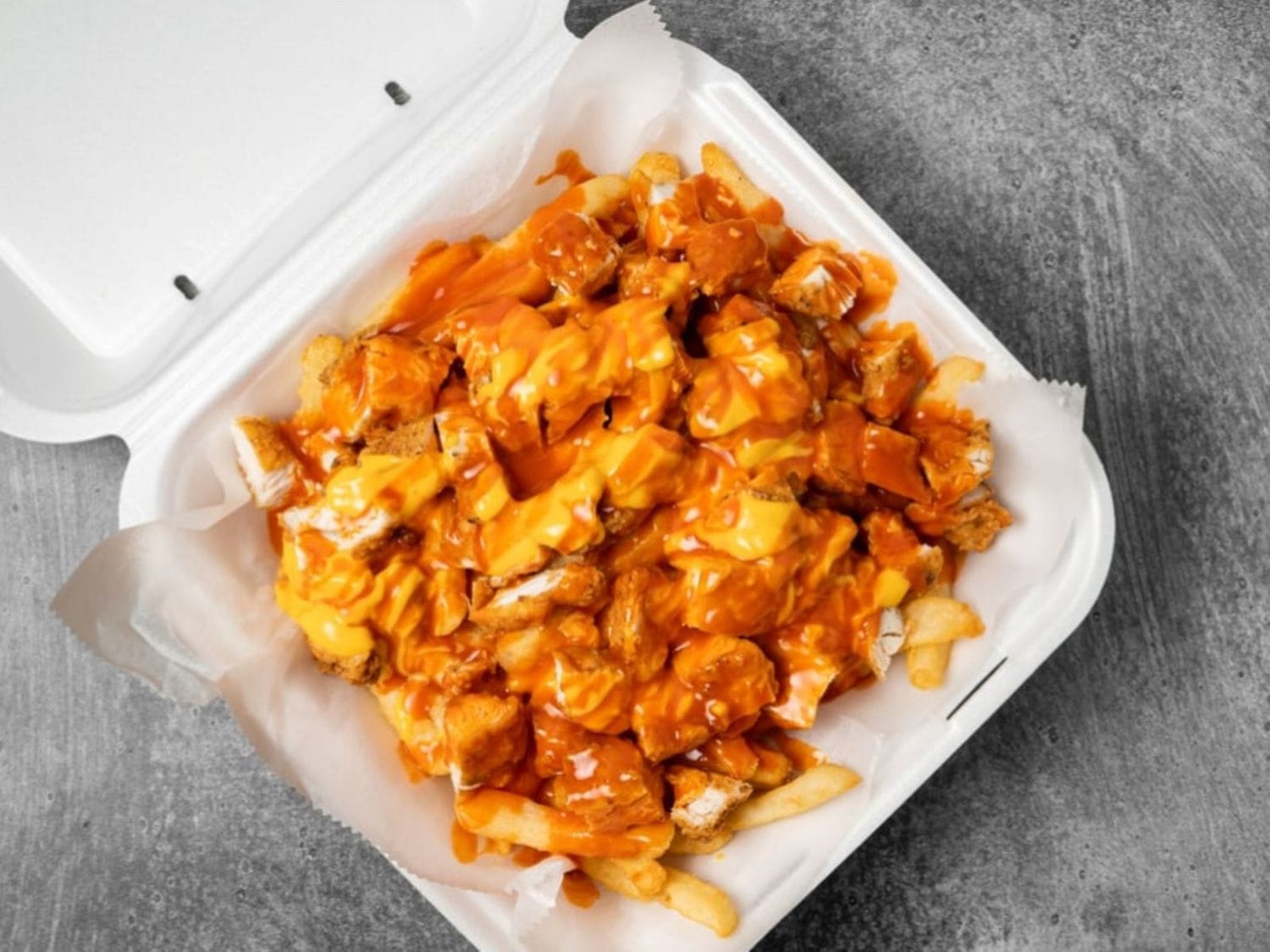 Buffalo chicken loaded cheese fries at Mayo Grill in Aurora