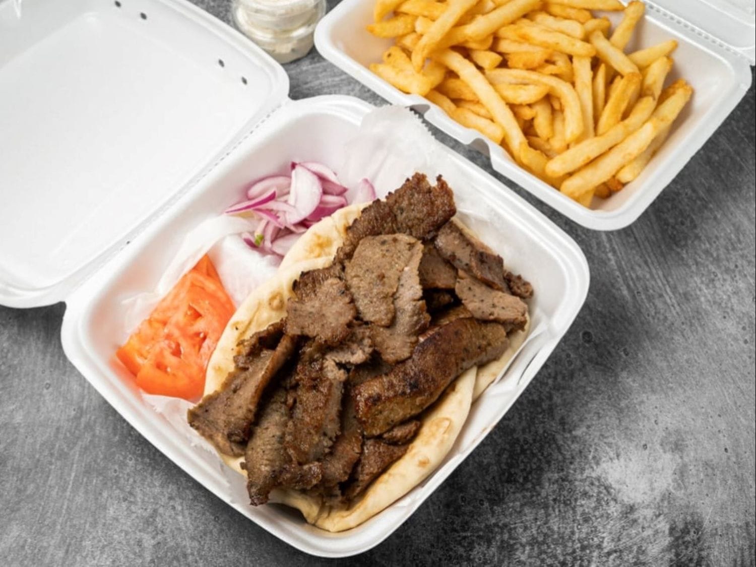 Gyro plate with extra meat, pita, vegetables, tzatziki, and fries at Mayo Grill in Aurora