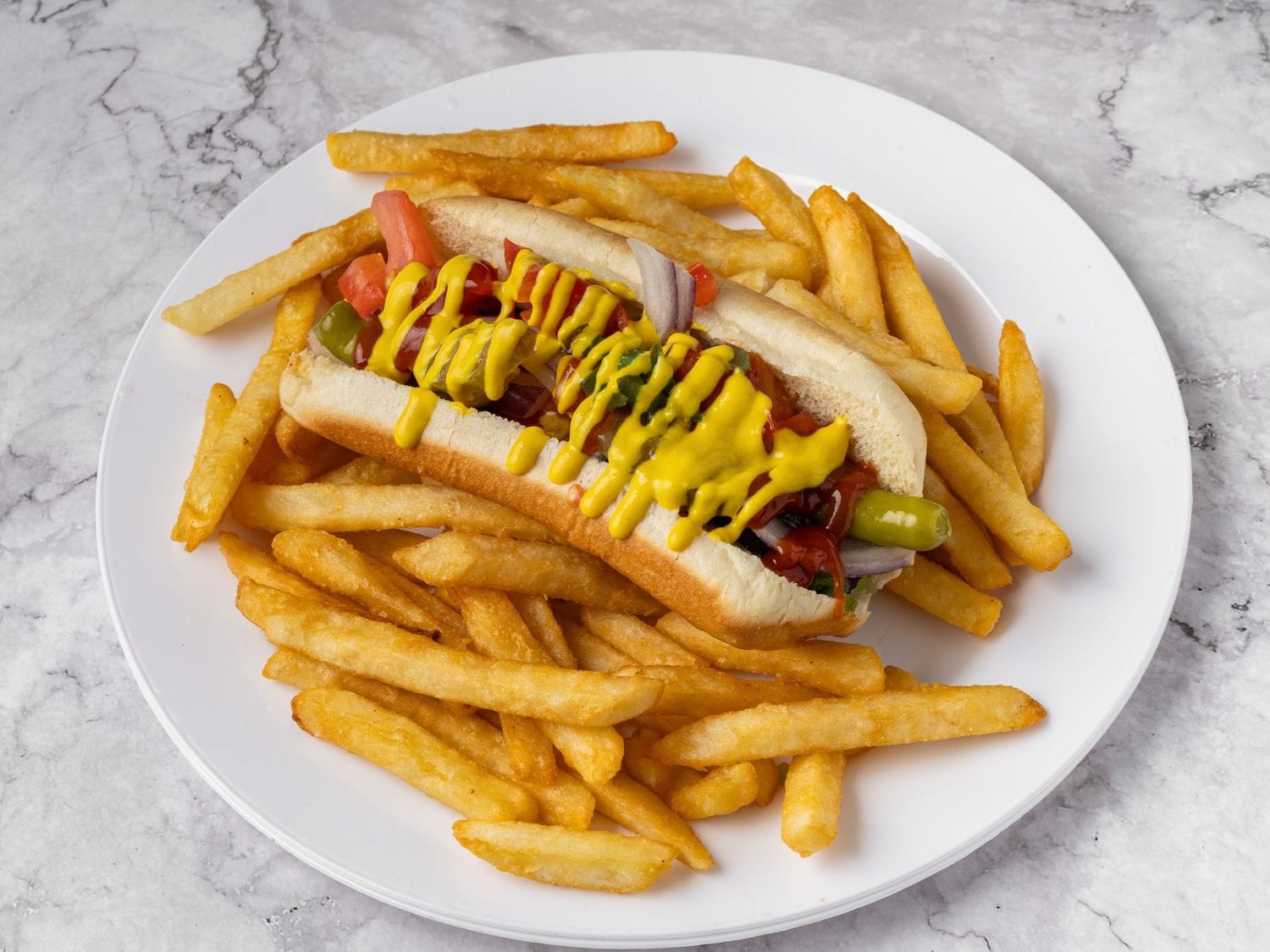 All-beef hot dog meal with toppings and fries from Mayo Grill in Aurora