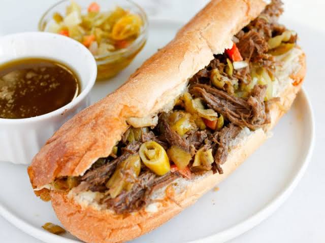 Mayo Grill Italian beef sandwich topped with giardiniera